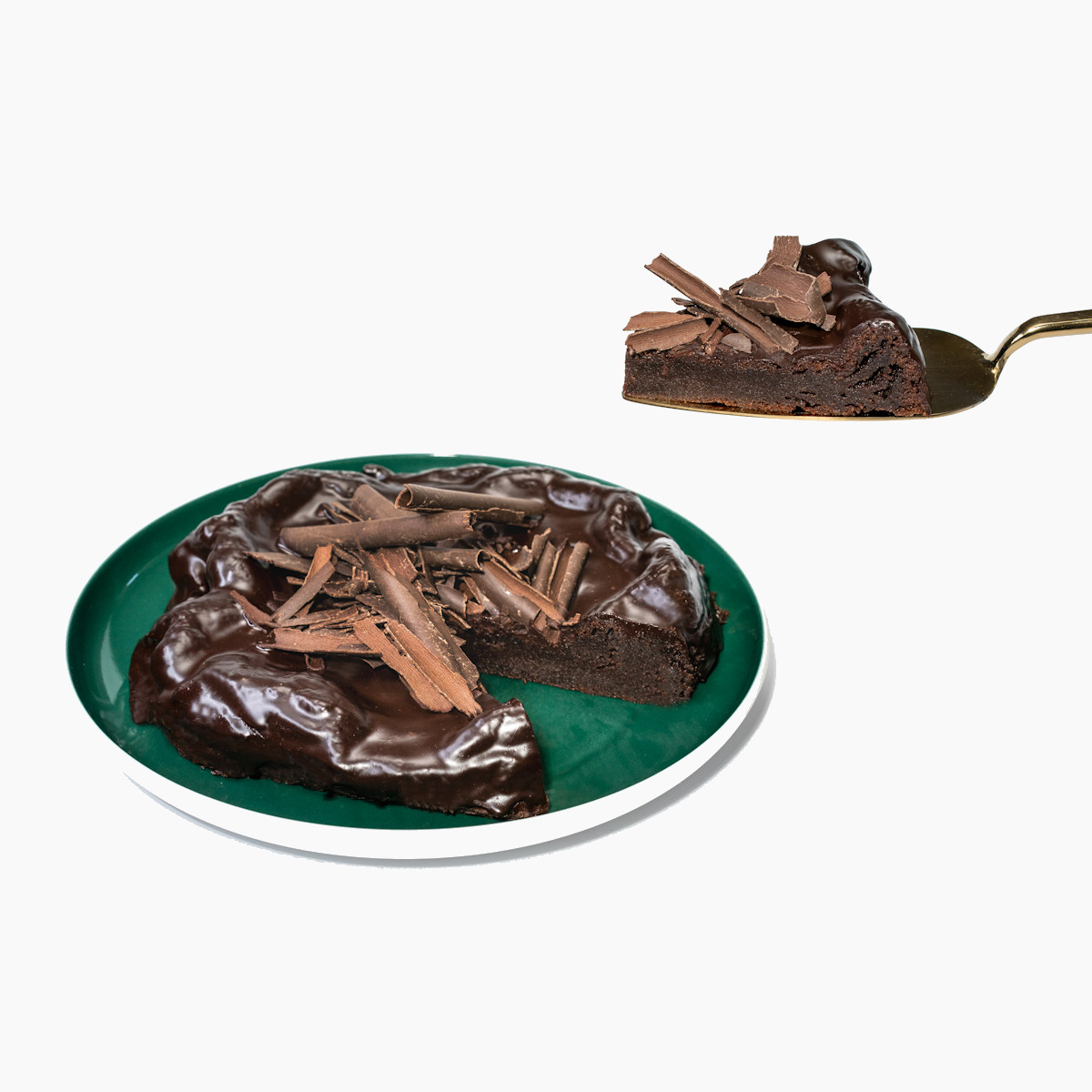 Porcový kousek Čokodortu Originál na dezertní lžíci, ukazující bohatou vrstvu čokoládové ganache a hobliny